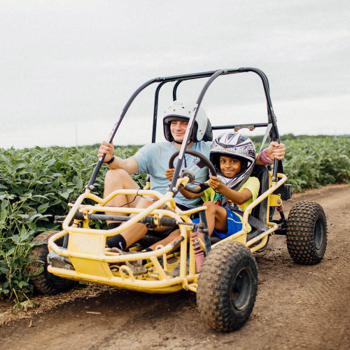Kids on an off-road vehicle.