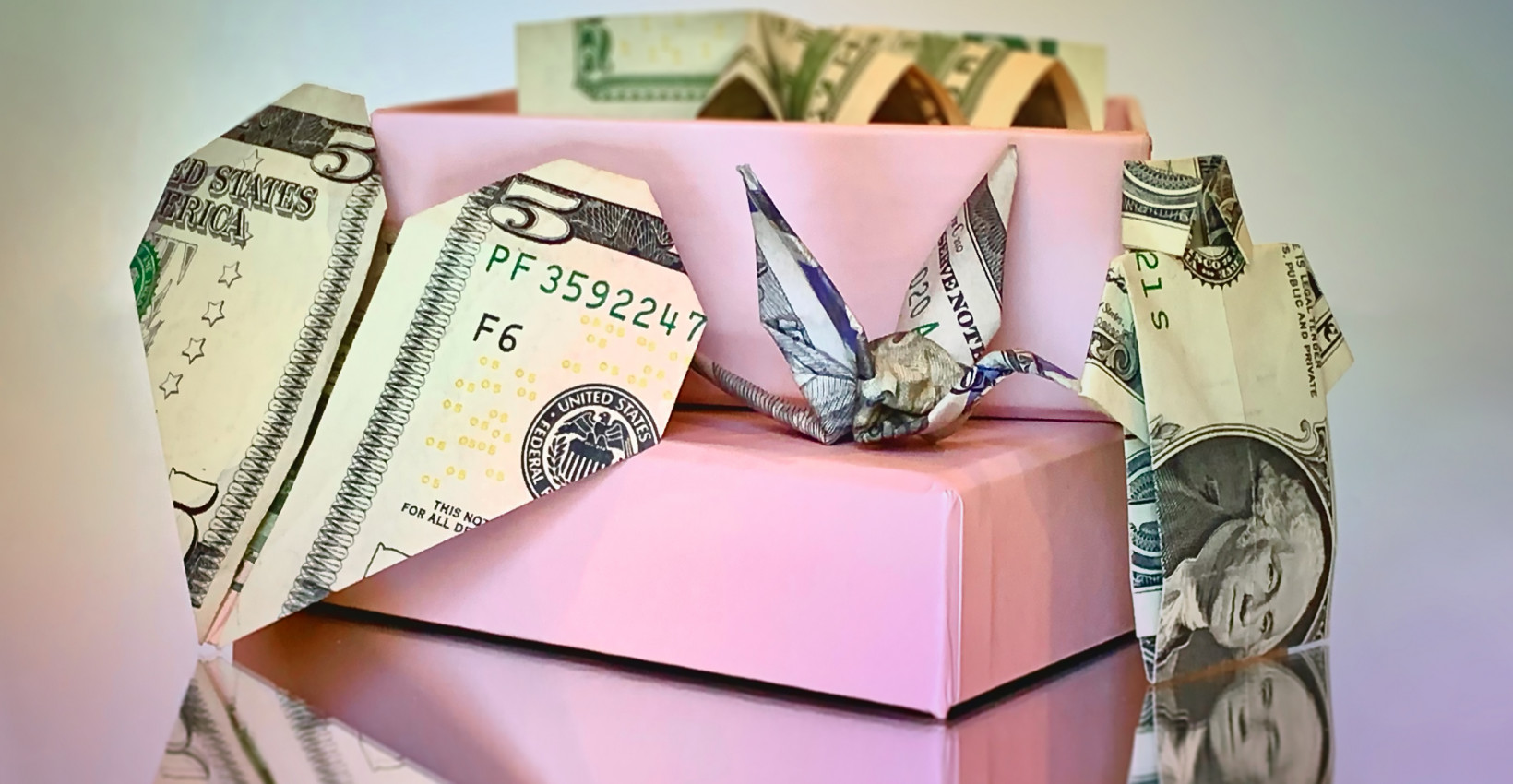 A paper origami swan made out of cash