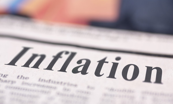A newspaper with the headline "Inflation"